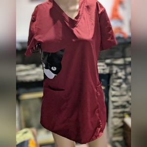 Maroon scrub top. Size women's medium.  Pockets.